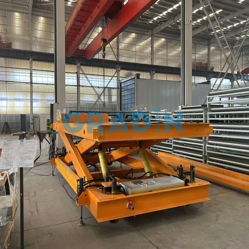 A heavy-duty hydraulic scissor lift supporting a large industrial component in a factory.
